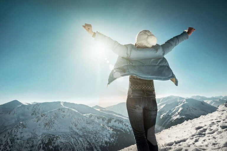 woman standing in front of mountains